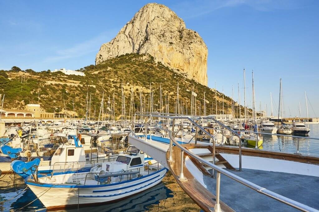 Penon de Ifach and fishing harbor in Calpe city. Spain